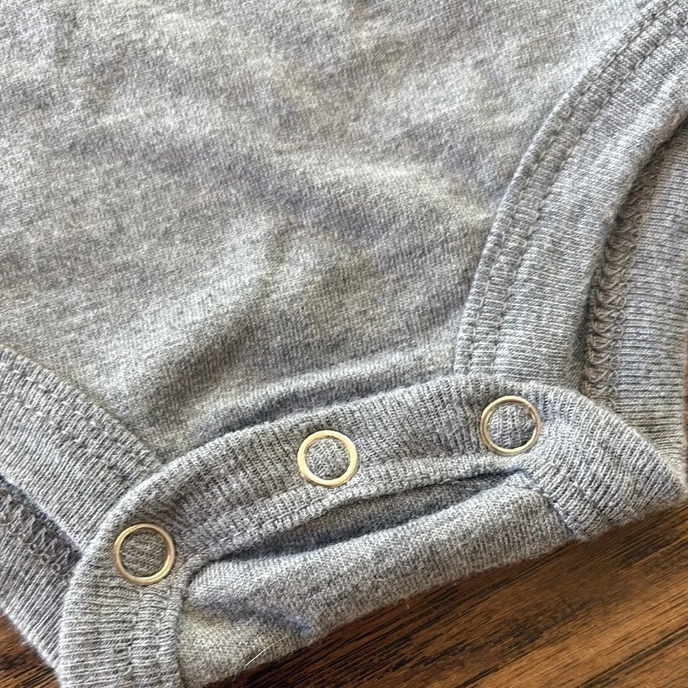 Gray Homage Legends Never Cry Baby Onesie